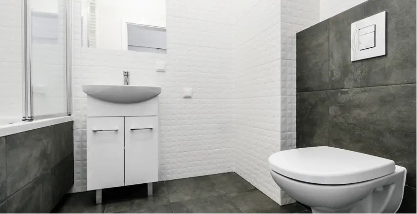Photo : beau résultat salle de bains avec carrelage béton et sanitaires basiques